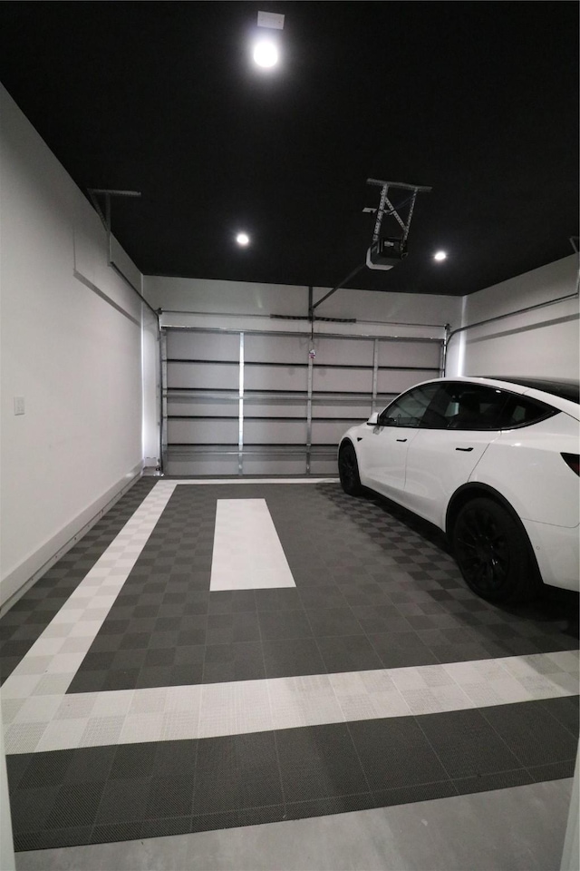 113 E 32nd St Unit A, Houston, TX 77018 - garage featuring baseboards and a garage door opener