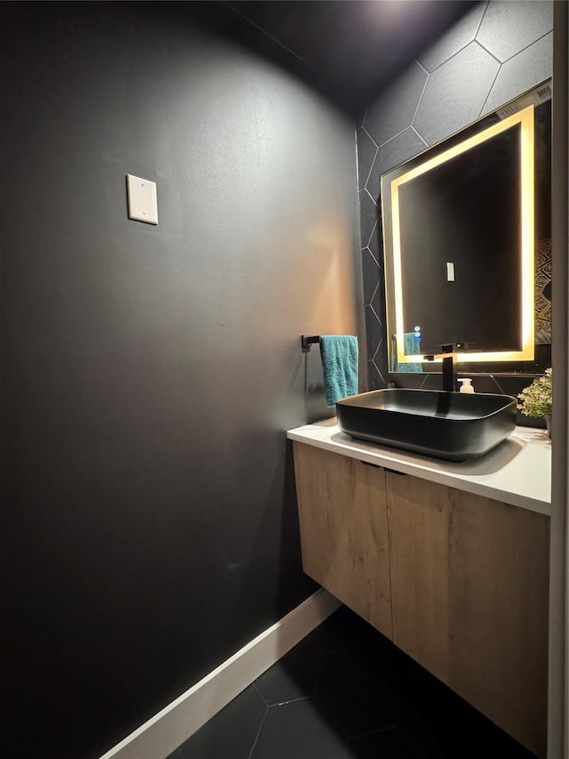 113 E 32nd St Unit A, Houston, TX 77018 - bathroom featuring vanity, tile patterned flooring, and baseboards