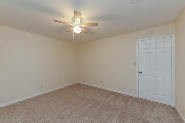 18610 Anne Dr, Webster, TX 77058 - empty room with light colored carpet, a ceiling fan, and baseboards