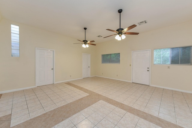 18610 Anne Dr, Webster, TX 77058 - empty room featuring light tile patterned floors, a ceiling fan, and baseboards