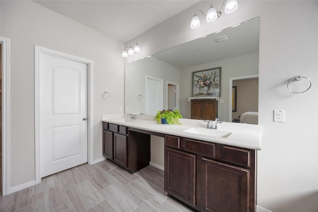 18219 Octavio Frias Trl, Houston, TX 77044 - ensuite bathroom featuring double vanity and baseboards