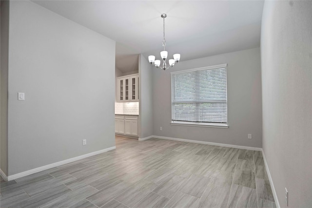 18219 Octavio Frias Trl, Houston, TX 77044 - spare room with a chandelier and light wood-style floors