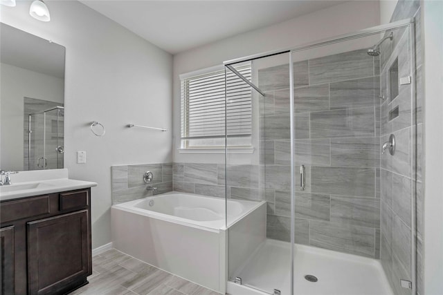 18219 Octavio Frias Trl, Houston, TX 77044 - bathroom with a garden tub, vanity, and a stall shower