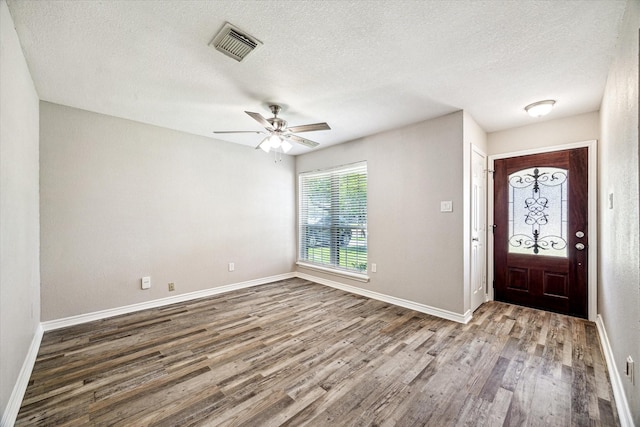 2531 Meandering Trl, Houston, TX 77339 - foyer with wood finished floors, a textured ceiling, baseboards, and a ceiling fan