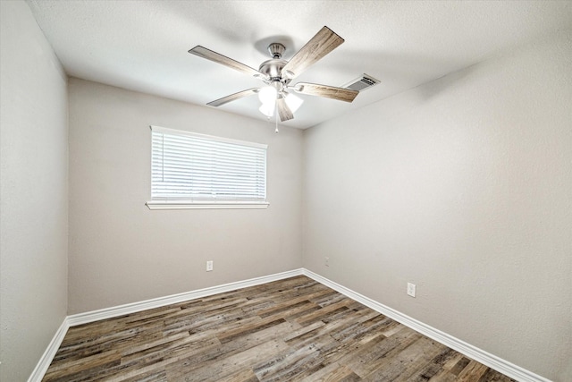2531 Meandering Trl, Houston, TX 77339 - unfurnished room with wood finished floors, a ceiling fan, and baseboards