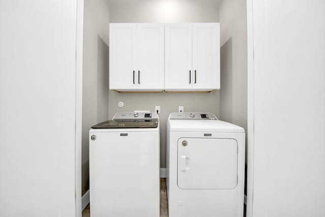 1805 Blodgett St, Houston, TX 77004 - laundry room featuring cabinet space and washer and clothes dryer