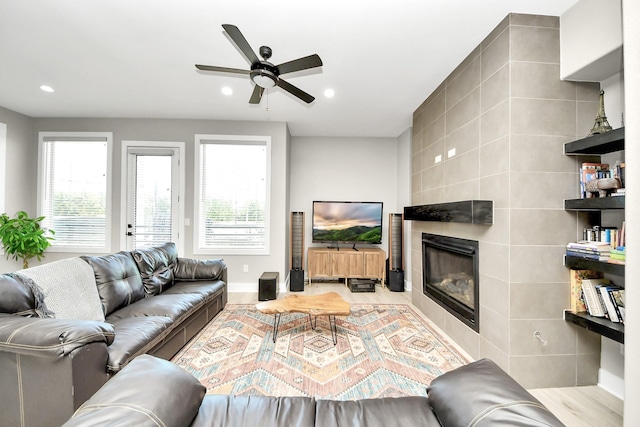 1805 Blodgett St, Houston, TX 77004 - living area with a tiled fireplace, ceiling fan, recessed lighting, and baseboards