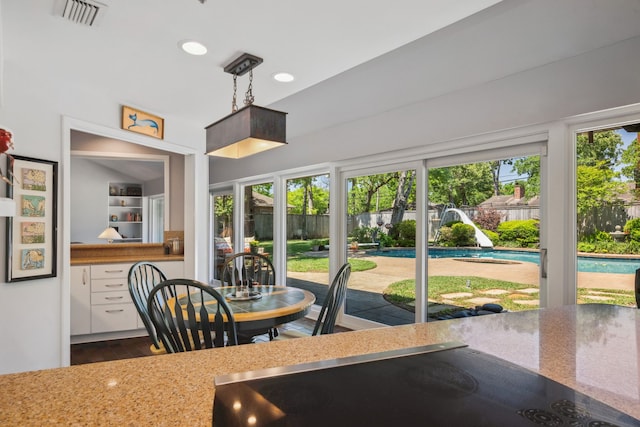 10318 Pine Forest Rd, Houston, TX 77042 - dining space with plenty of natural light, dark wood finished floors, and recessed lighting