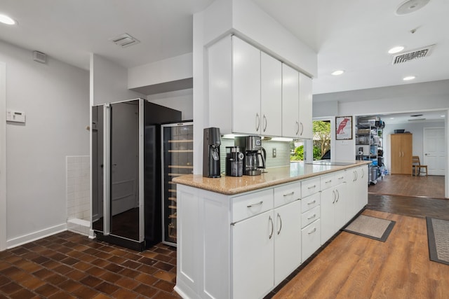 10318 Pine Forest Rd, Houston, TX 77042 - kitchen with white cabinets, baseboards, recessed lighting, and tasteful backsplash