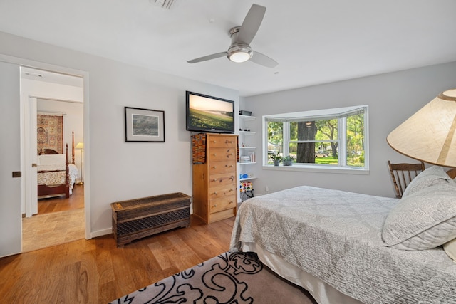 10318 Pine Forest Rd, Houston, TX 77042 - bedroom featuring wood finished floors and a ceiling fan