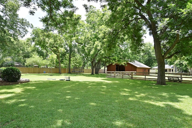 3919 Aspenwood Dr, Richmond, TX 77406 - view of yard featuring an exterior structure and an outdoor structure