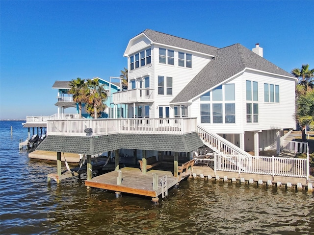131 Isles End Rd, Tiki Island, TX 77554 - dock featuring a water view, stairs, and boat lift
