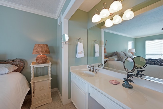131 Isles End Rd, Tiki Island, TX 77554 - ensuite bathroom featuring ornamental molding, vanity, baseboards, and a textured ceiling