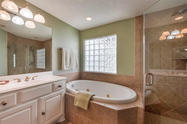 131 Isles End Rd, Tiki Island, TX 77554 - full bath featuring a tub with jets, a stall shower, and vanity