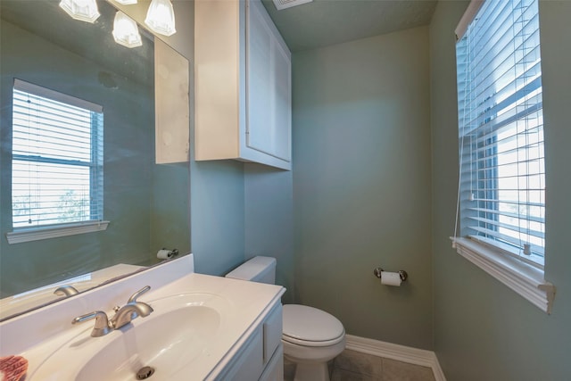 131 Isles End Rd, Tiki Island, TX 77554 - half bath featuring toilet, vanity, tile patterned floors, and baseboards