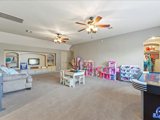 17806 Creek Bluff Ln, Cypress, TX 77433 - rec room with carpet flooring, ceiling fan, and arched walkways