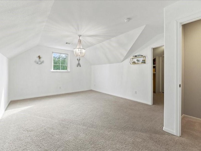 17806 Creek Bluff Ln, Cypress, TX 77433 - bonus room with lofted ceiling, carpet, baseboards, and a chandelier