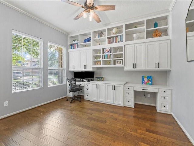 17806 Creek Bluff Ln, Cypress, TX 77433 - office with built in study area, ceiling fan, dark wood finished floors, baseboards, and ornamental molding