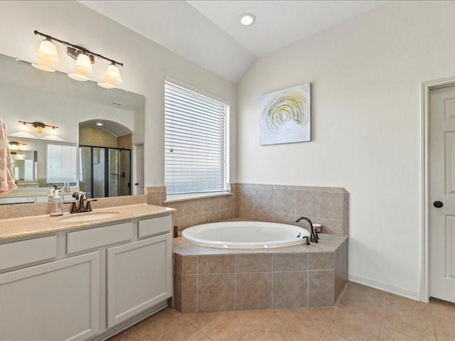 17806 Creek Bluff Ln, Cypress, TX 77433 - bathroom featuring vanity, a shower stall, tile patterned floors, a garden tub, and lofted ceiling