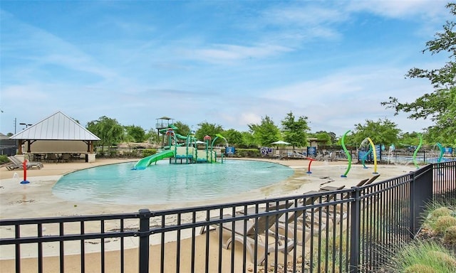 17806 Creek Bluff Ln, Cypress, TX 77433 - community pool featuring a water play area, a gazebo, a water slide, and a patio
