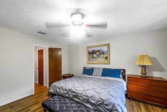 6902 Wagonwheel Ln, Houston, TX 77088 - bedroom with wood finished floors, baseboards, and ceiling fan