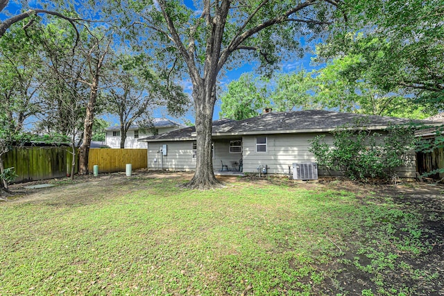 6902 Wagonwheel Ln, Houston, TX 77088 - back of house featuring central AC