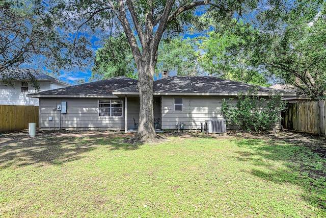 6902 Wagonwheel Ln, Houston, TX 77088 - rear view of property featuring central AC unit and a chimney