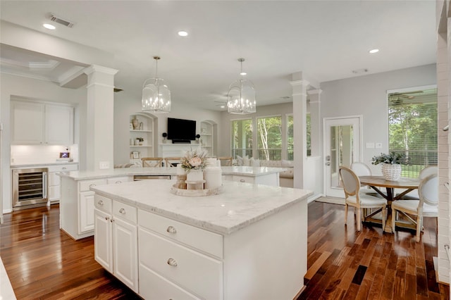 3350 Precinct Line Rd, Richmond, TX 77406 - kitchen with wine cooler, a center island, dark wood-style floors, plenty of natural light, and recessed lighting