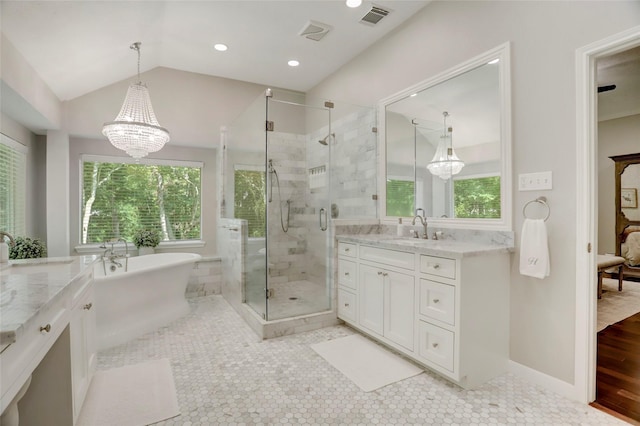 3350 Precinct Line Rd, Richmond, TX 77406 - bathroom featuring vanity, a shower stall, a freestanding tub, a chandelier, and lofted ceiling