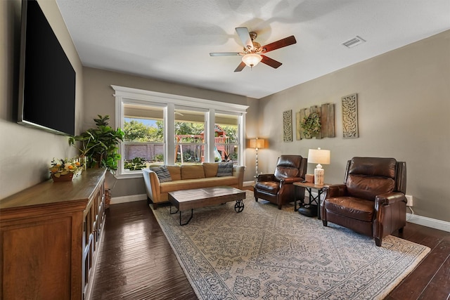 14327 Cranbrook Creek Ln, Houston, TX 77044 - living area featuring a ceiling fan, dark wood finished floors, and baseboards