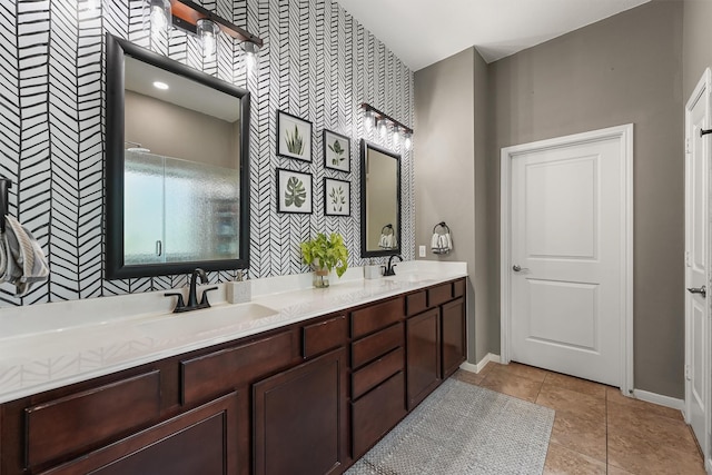 14327 Cranbrook Creek Ln, Houston, TX 77044 - full bath featuring wallpapered walls, baseboards, an accent wall, double vanity, and tile patterned floors