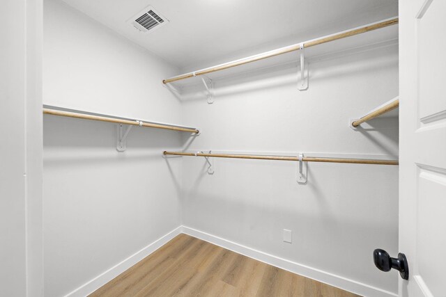 7109 Saint Augustine St, Houston, TX 77021 - walk in closet featuring wood finished floors