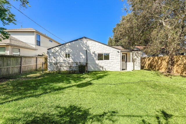 7109 Saint Augustine St, Houston, TX 77021 - rear view of house featuring stone siding