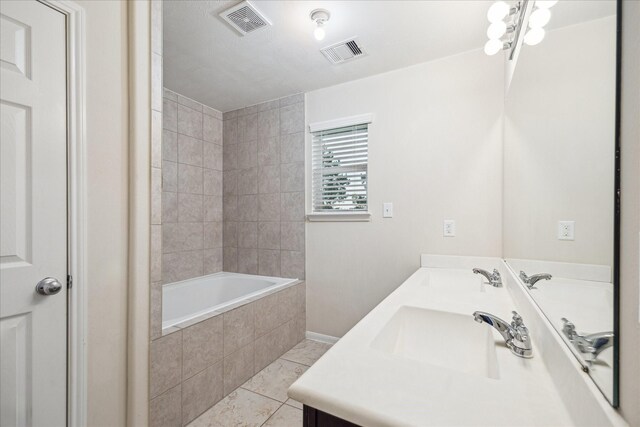 18621 Serenity Loch Dr, Spring, TX 77379 - full bathroom featuring tile patterned floors, double vanity, tiled shower / bath combo, and baseboards