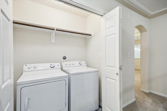 18621 Serenity Loch Dr, Spring, TX 77379 - laundry area with carpet, independent washer and dryer, arched walkways, and baseboards