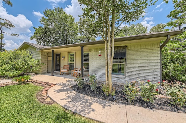 29742 Geneva Dr, Spring, TX 77386 - single story home with brick siding and a porch