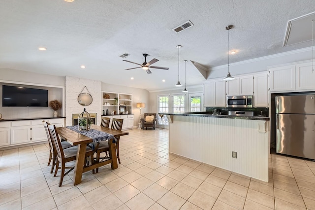 29742 Geneva Dr, Spring, TX 77386 - dining room featuring light tile patterned floors, a ceiling fan, recessed lighting, built in shelves, and ornamental molding