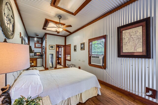 29742 Geneva Dr, Spring, TX 77386 - bedroom featuring cooling unit, wood finished floors, and ornamental molding