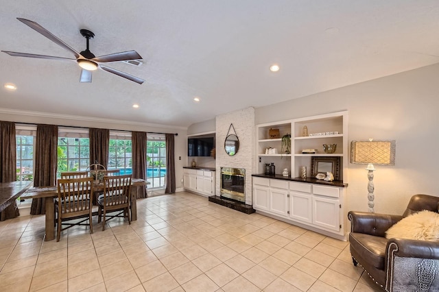 29742 Geneva Dr, Spring, TX 77386 - living room featuring ceiling fan, light tile patterned flooring, ornamental molding, a fireplace, and recessed lighting