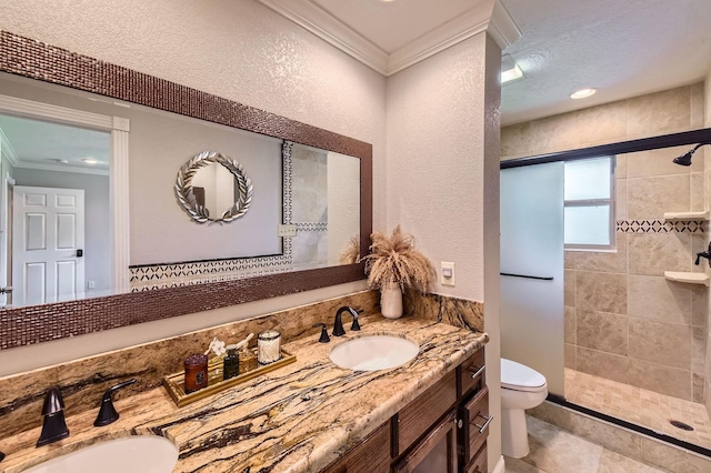 29742 Geneva Dr, Spring, TX 77386 - full bathroom with crown molding, toilet, double vanity, tiled shower, and a textured wall