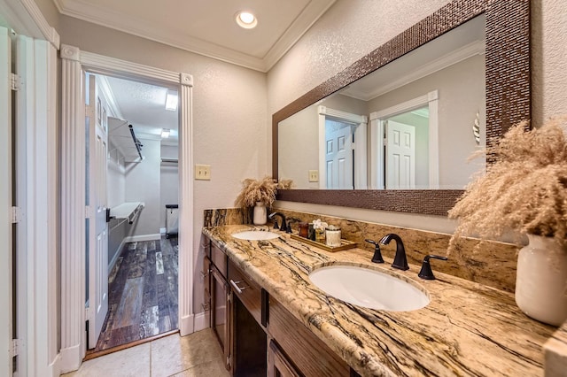 29742 Geneva Dr, Spring, TX 77386 - full bath with double vanity, crown molding, and tile patterned floors