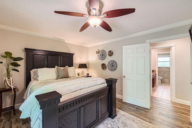 29742 Geneva Dr, Spring, TX 77386 - bedroom with light wood-type flooring, ornamental molding, baseboards, a textured ceiling, and ceiling fan