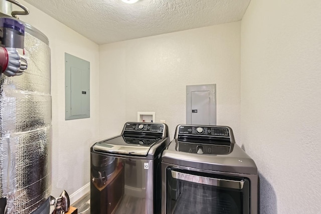 29742 Geneva Dr, Spring, TX 77386 - laundry room featuring electric panel, independent washer and dryer, a textured ceiling, and baseboards