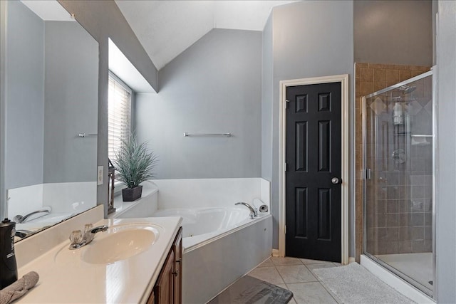 8511 Silver Lure Dr, Humble, TX 77346 - full bath featuring vanity, a garden tub, a stall shower, and vaulted ceiling