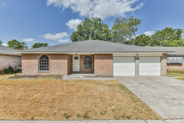 23203 Pennsgrove Rd, Spring, TX 77373 - ranch-style house featuring an attached garage, concrete driveway, a front yard, brick siding, and a shingled roof