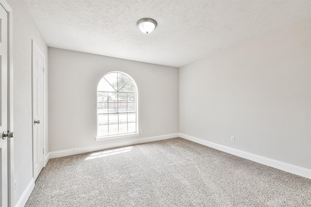 23203 Pennsgrove Rd, Spring, TX 77373 - spare room with carpet, a textured ceiling, and baseboards