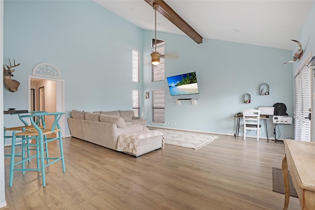 1114 Tiki Dr, Galveston, TX 77554 - living area with high vaulted ceiling, wood finished floors, and beamed ceiling