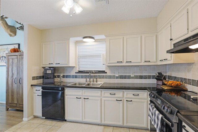 1114 Tiki Dr, Galveston, TX 77554 - kitchen featuring black appliances, under cabinet range hood, white cabinets, dark countertops, and backsplash