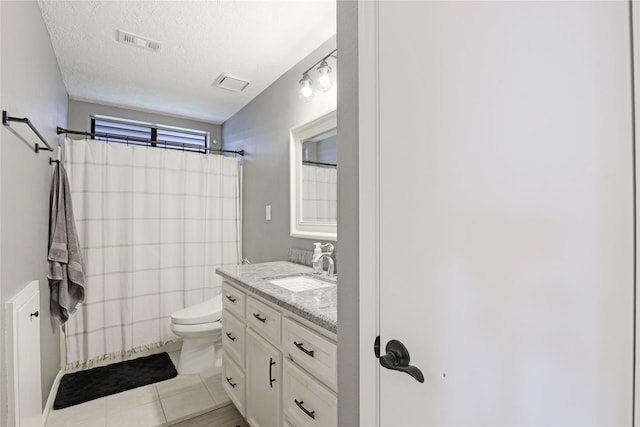 1114 Tiki Dr, Galveston, TX 77554 - bathroom featuring vanity, tile patterned flooring, a textured ceiling, and curtained shower