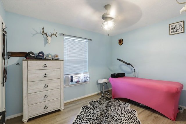 1114 Tiki Dr, Galveston, TX 77554 - bedroom featuring wood finished floors and a ceiling fan